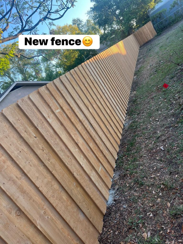 New pressure-treated wood fence installed by Yoder Fence Solutions